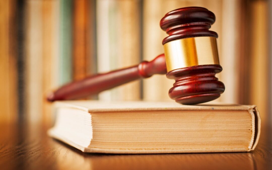 Wooden gavel resting on a law book